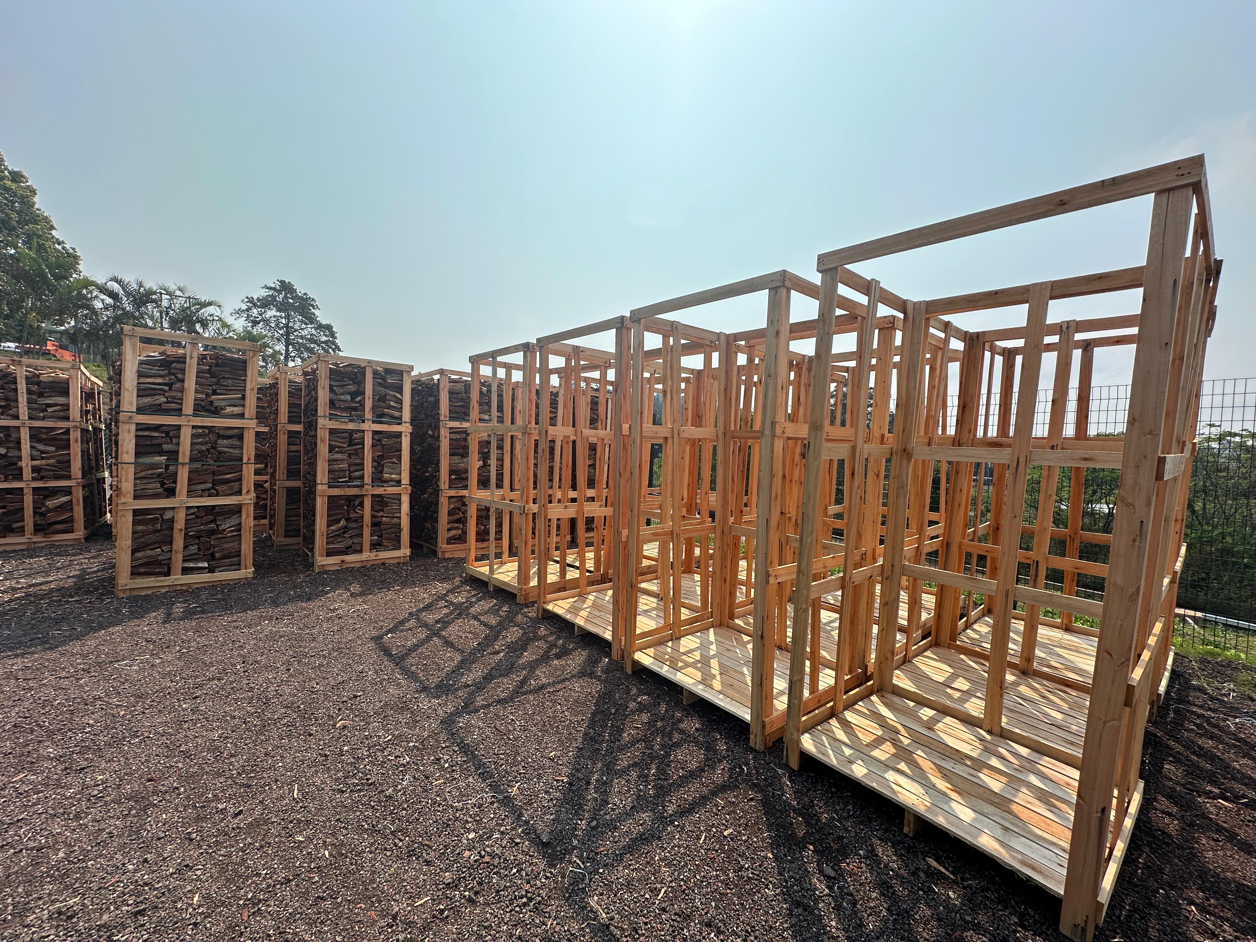 Large stacks of Kameeldoring firewood in warehouse storage